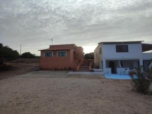a house and a house with a yard at Appartamenti Za Barbara in Lampedusa
