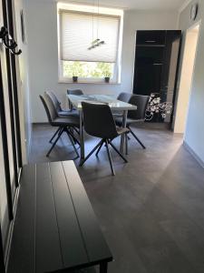 a dining room with a table and chairs at 1 A Ferienwohnung Modern Duisburg in Duisburg