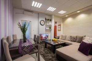 a living room with a couch and a table at Apartment Vukanja in Belgrade