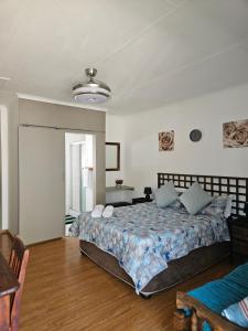 a bedroom with a large bed in a room at Garden Corner Guesthouse in Vereeniging