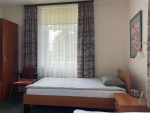 Postel nebo postele na pokoji v ubytování Livonija
