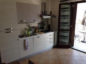 Køkken eller tekøkken på La Quiete Anna Apartment + 16 billeder