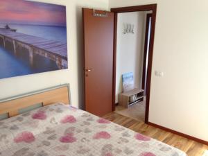 En eller flere senge i et værelse på La Quiete Anna Apartment