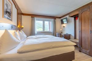 Letto o letti in una camera di Hotel Dischma
