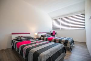 Posteľ alebo postele v izbe v ubytovaní Villa Natalija
