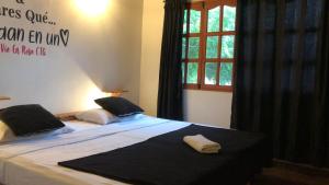 Postel nebo postele na pokoji v ubytování Casa Hostal La Vie en Rose