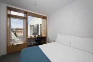 เตียงในห้องที่ Trinity College - Campus Accommodation