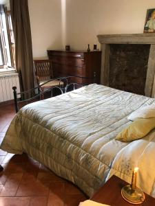 Postel nebo postele na pokoji v ubytování Agriturismo Melodie Toscane Sorano