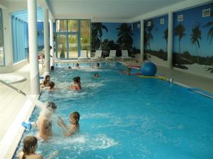 a group of people in a swimming pool at Alga Activ in Mrzeżyno