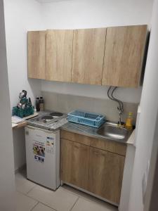 a small kitchen with a sink and a dishwasher at Guesthouse Gravosa in Dubrovnik +10 photos