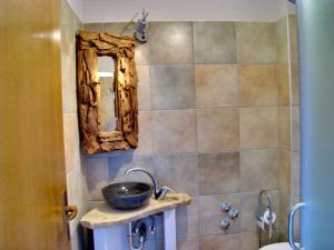 a bathroom with a sink and a mirror at Appartement Caspar- Turm Krk in Sveti Vid-Miholjice +15 photos