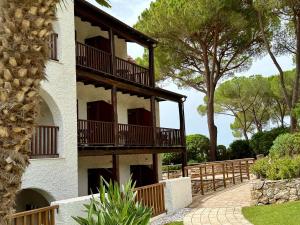 a building with balconies on the side of it at Hotel Punta Negra in Alghero