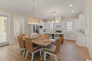 a kitchen and dining room with a table and chairs at Time Flys - 498 Baisden Lane in Mallory Park