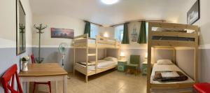 Postel nebo postele na pokoji v ubytování Nomado Hostel