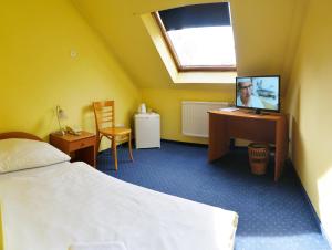 Posteľ alebo postele v izbe v ubytovaní Corvin Hotel