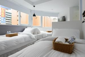 Postel nebo postele na pokoji v ubytování Poshpacker Hotel