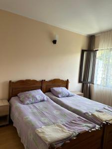 Postel nebo postele na pokoji v ubytování Temo's Guesthouse