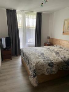 Postel nebo postele na pokoji v ubytování WaldWunder Winterberg