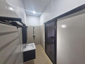 Koupelna v ubytování Satu Hati Hotel + 28 fotografií