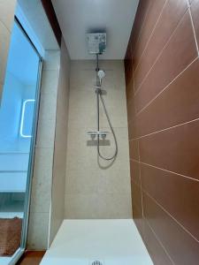 a shower in a bathroom with a mirror at T3 avec jardin - mer, soleil et tout à pied in Cavalaire-sur-Mer