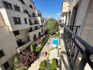 a balcony view of a hotel with a swimming pool at Apartments Amara Sunny Beach in Sunny Beach