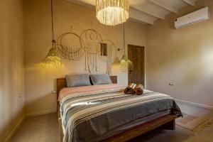 Postel nebo postele na pokoji v ubytování Mannam apartment boho