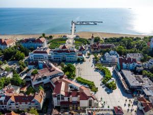 an aerial view of a town next to the ocean at SeaSide Sopot - butikowe noclegi przy plaży in Sopot