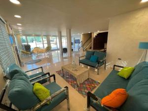 a living room with couches and a couch and a table at شاليهات ومسابح مزارع in Al Azraq ash Shamālī