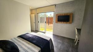 Postel nebo postele na pokoji v ubytování OlivaNegra Resort - Oliva1