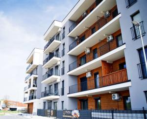 an image of an apartment building with balconies at Magic Apartments - Siena in Zator