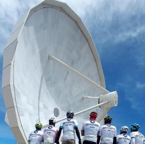 a group of people standing in front of a large satellite dish at TODOSIERRANEVADA ZONA BAJA - MONTBLANC VISTAS A LA MONTANA - Junto a los Telecabinas in Sierra Nevada