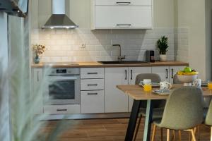 Kuchyň nebo kuchyňský kout v ubytování M&N Penthouse