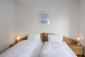 Postel nebo postele na pokoji v ubytování Fee-rien