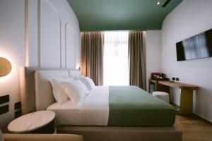 TV a/nebo společenská místnost v ubytování Noemie Hotel