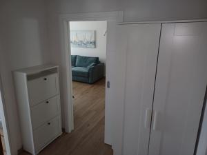 a living room with a couch and a closet at Villa Arija Brela in Brela