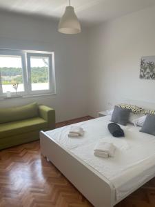 Postel nebo postele na pokoji v ubytování Laganini apartman Rab
