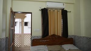 Mayapur Prakash客房内的一张或多张床位