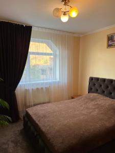 Postel nebo postele na pokoji v ubytování Cottage u Romana