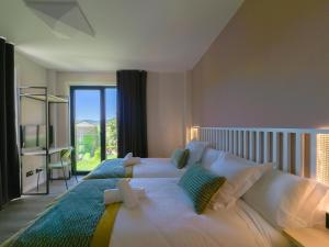 Ένα ή περισσότερα κρεβάτια σε δωμάτιο στο HOTEL PORTOMARÍN STAR
