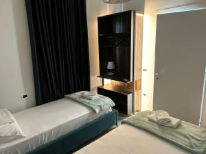 Postel nebo postele na pokoji v ubytování OLEA Family Apt Sea View