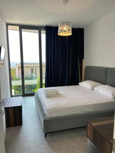 Postel nebo postele na pokoji v ubytování OLEA Family Apt Sea View