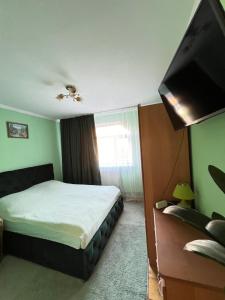Postel nebo postele na pokoji v ubytování Cottage u Romana