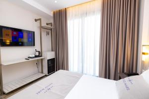 Cama ou camas em um quarto em PATIO MARE