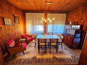 a dining room with a table and chairs at Zorica House Vrbas in Vrbas +10 photos