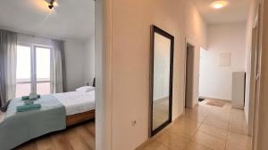 Postel nebo postele na pokoji v ubytování Conte Čikara Apartment