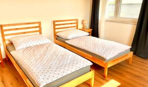 Postel nebo postele na pokoji v ubytování Burgenland Chalet