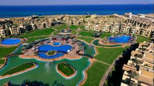 an aerial view of a resort with three ponds at Elsokhna BlueBay Asia For families only in Ain Sokhna