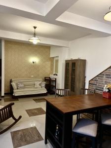 a living room with a table and a couch at Marsali Vila in Constanţa +15 photos