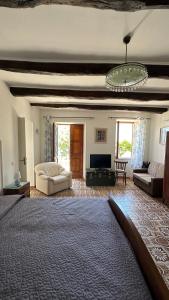 a large living room with a couch and a tv at Casa Vacanze Nonna Sissi in Maratea +19 photos