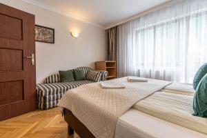 Posteľ alebo postele v izbe v ubytovaní WILLA ORNAK